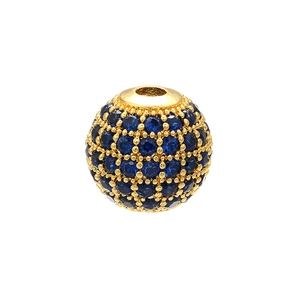 Detail of a gold copper bead with blue micro-pave crystals for DIY jewelry making