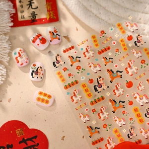 Cute horse and lucky charm nail art stickers in warm orange and pink tones