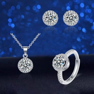 Luxury three-piece silver jewelry set with halo necklace, ring, and stud earrings