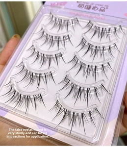 Close-up of natural fairy style false eyelashes with transparent bands and 5 pairs