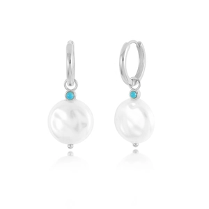 Macro detail of 925 sterling silver twist earring with blue turquoise and baroque pearl