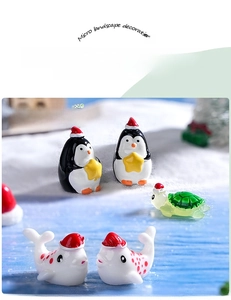 Macro view of mini resin Christmas sea animals including penguin and turtle figurines
