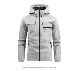 Detail of light gray windbreaker jacket featuring drawstring hood and zip pockets