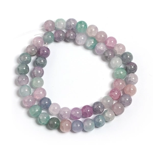 Detailed macro view of colorful ice-crack patterned glass beads for DIY jewelry making