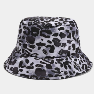 Detailed close-up of quilted leopard print fabric and stitching on a bucket hat