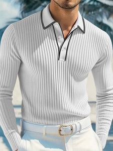 Detail of white men's long sleeve polo shirt with vertical knit stripes and buttoned lapel