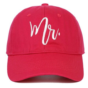 Detail of red cotton baseball cap featuring white Mr. script embroidery on the front