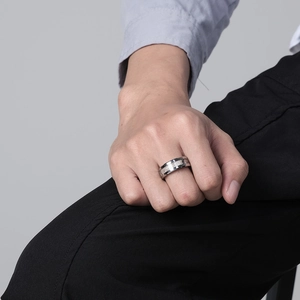 Men's silver tungsten carbide ring with camouflage inlay texture on male hand model