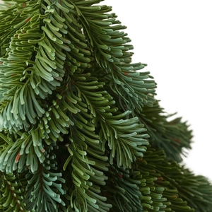 Detailed view of high-simulation PE artificial mini Christmas tree with lifelike pine needles