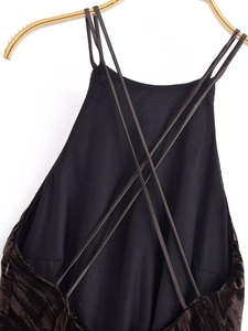 Detail of dark brown velvet dress showing the intricate crisscross lace-up back design