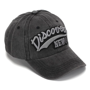 Detailed close-up of 3D embroidery on washed dark gray vintage cotton baseball cap