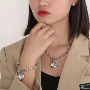 Silver stainless steel OT toggle necklace and bracelet set with crystal heart pendants