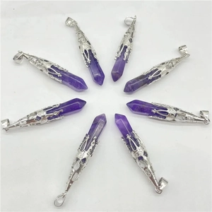 Amethyst hexagonal crystal point pendants with silver filigree in circular arrangement