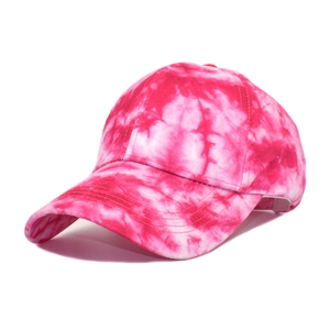 Close-up of pink tie-dye tie-dye baseball cap featuring six-panel crown and reinforced brim