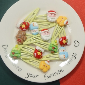 12-piece Christmas hair clip set with resin Santa, snowman and reindeer designs
