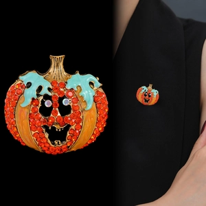 Exaggerated orange rhinestone pumpkin brooch for Halloween fashion jewelry styling