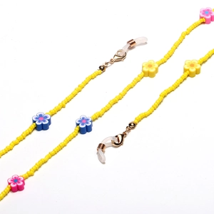 Detail of yellow beaded eyeglass chain with colorful polymer clay sunflower charms