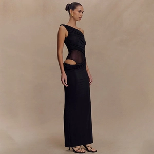 Detail of elegant black one-shoulder dress featuring waist cut-out and ruched texture
