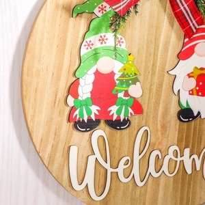 Wooden Christmas gnome welcome door sign with red green plaid bow and festive ornaments