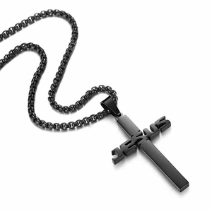 Close-up of black stainless steel Jesus cross pendant with a detailed box chain necklace
