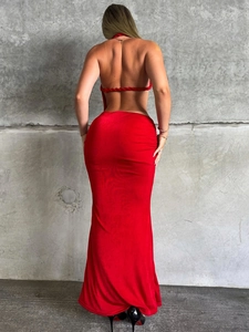 Detail of red backless evening dress featuring criss-cross lace-up ropes and slim fit cut