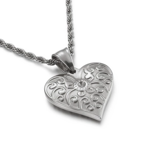 Retro engraved silver heart pendant necklace with intricate swirl patterns and rope chain