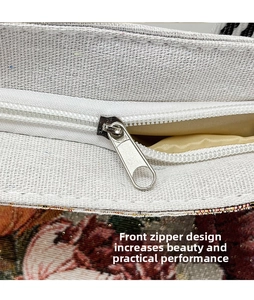 Detailed close-up of ivory canvas bag with 3D embroidery and silver metal zipper design