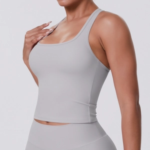 Detail view of high-elastic light grey racerback yoga vest with matte athletic fabric