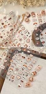 Close-up of M-1259 nail stickers with cute brown puppy, bear, and heart patterns