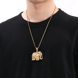 Golden elephant pendant necklace with sparkling diamonds shown on male model