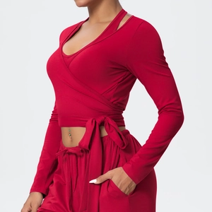 Close-up of deep red sports set featuring wrap V-neck top and drawstring jogger pants