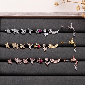 Variety of stainless steel cartilage studs in silver, gold, and rose gold finishes
