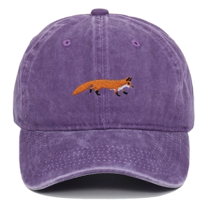 Close-up of intricate fox embroidery on vintage washed purple cotton baseball cap
