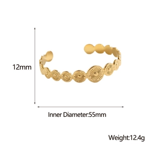 Detail of gold geometric open bangle showing 12mm width and 55mm inner diameter