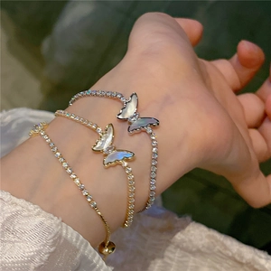 Detailed view of adjustable butterfly bracelets with mother of pearl and zircon stones
