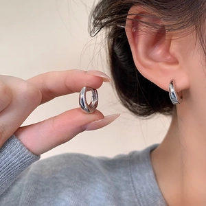 Polished silver teardrop hoop earrings for women made of minimalist stainless steel