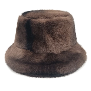 Plush brown faux fur bucket hat for winter featuring high volume and soft texture