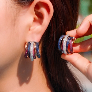 Three-tone multi-layer hoop earrings with micro-pave blue, red, and white cubic zirconia