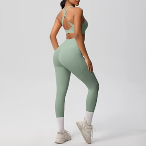 Detail view of double-sided brushed yoga set featuring cross-back bra and side pockets