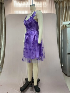 Detail view of purple tulle party dress with 3D butterfly appliques and thin straps