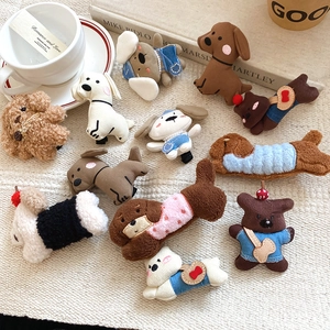 Detail of plush puppy hair clips made of teddy fleece with pearl and ribbon accents