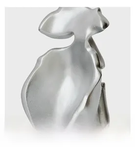 Macro shot of silver sculpture detail showing organic curves and matte frosted texture