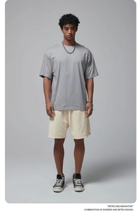 Oversized grey cotton T-shirt and beige drawstring shorts for a casual summer outfit