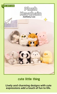 Set of eight assorted cute plush animal keychain charms on soft textured blanket