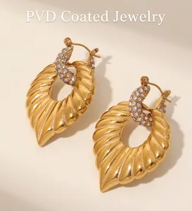 Detail of gold leaf hoop earrings with rhinestones using Electroplated PVD technology