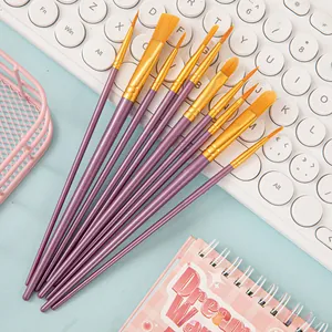 Detail of 10 purple nylon paintbrushes for watercolor and acrylic painting on blue background
