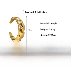 Polished gold acrylic C-shaped twisted cuff bracelet showing 19.3g weight and dimensions