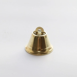 Close-up of a 38mm golden polished metal bell with a hanging loop for holiday decoration