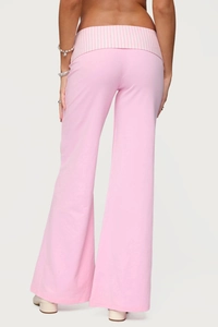 Detailed back view of pink wide-leg trousers featuring a striped fold-over waistband