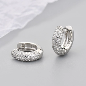Macro shot of silver S925 sterling silver hoop earrings with micro-pave cubic zirconia